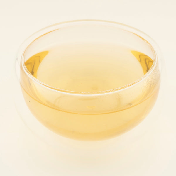 Dragon Pearl Jasmine Green Tea, brewed, in a clear glass [dragon-pearl-jasmine-green-tea-03-liquor]