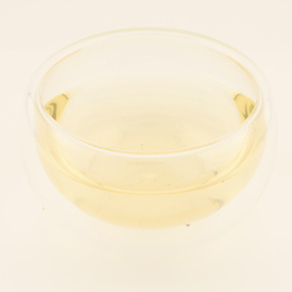 Dragon Well Green Tea, brewed, in a clear glass [dragon-well-green-tea-03-liquor]