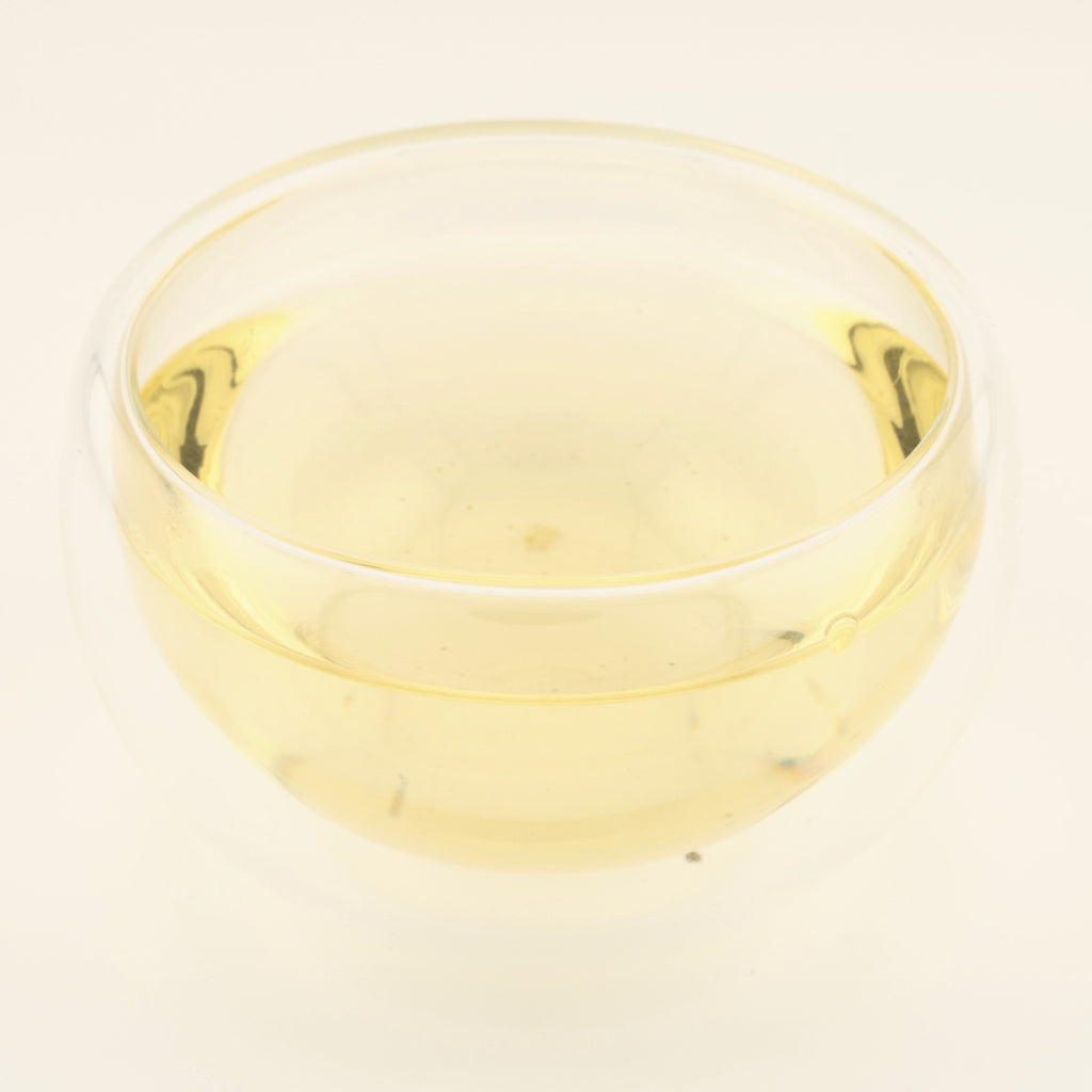 Early Spring Anji Baicha Green Tea, brewed, in a clear glass [early-spring-anji-baicha-green-tea-03-liquor]