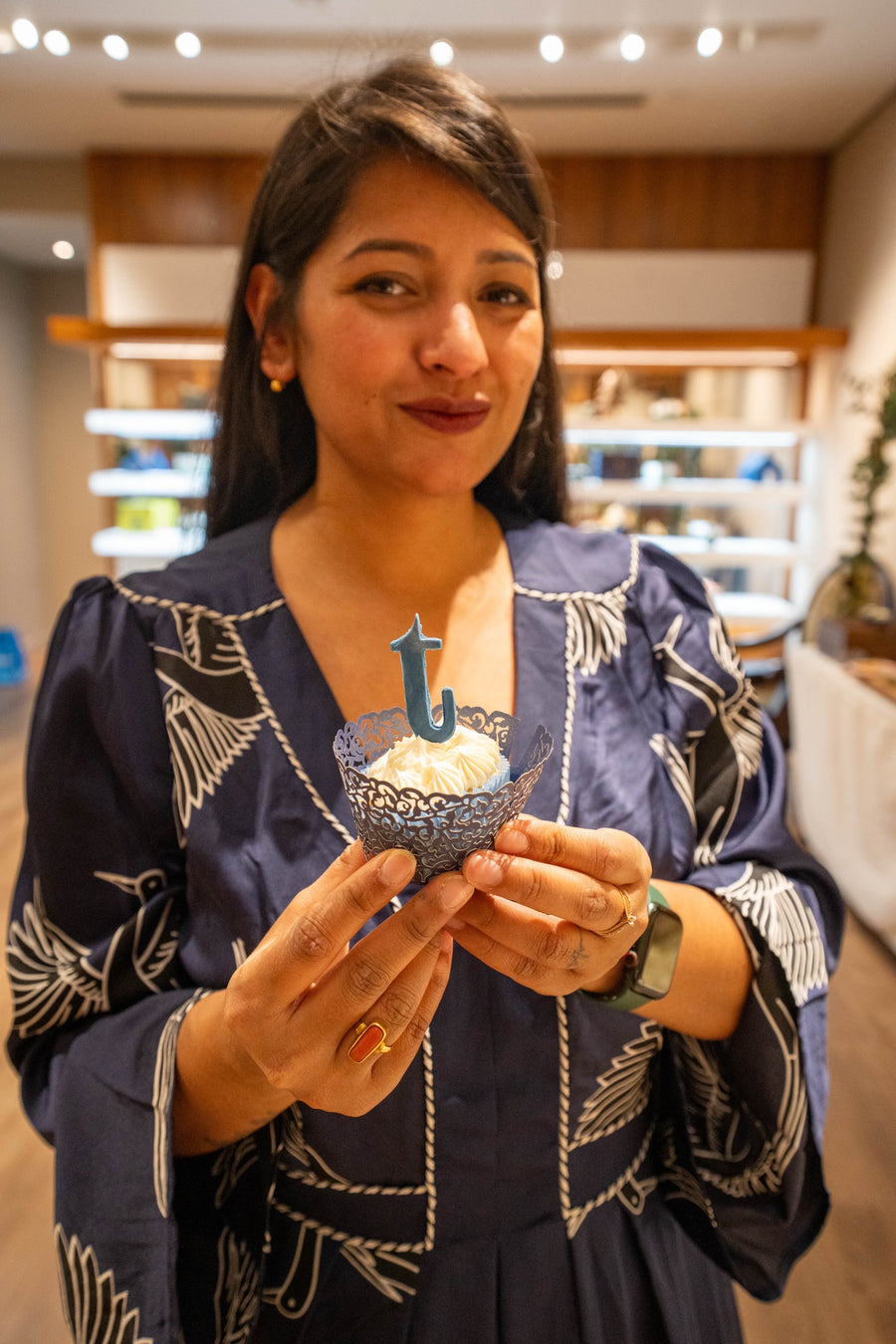 Rini with a celebration cupcake at the launch