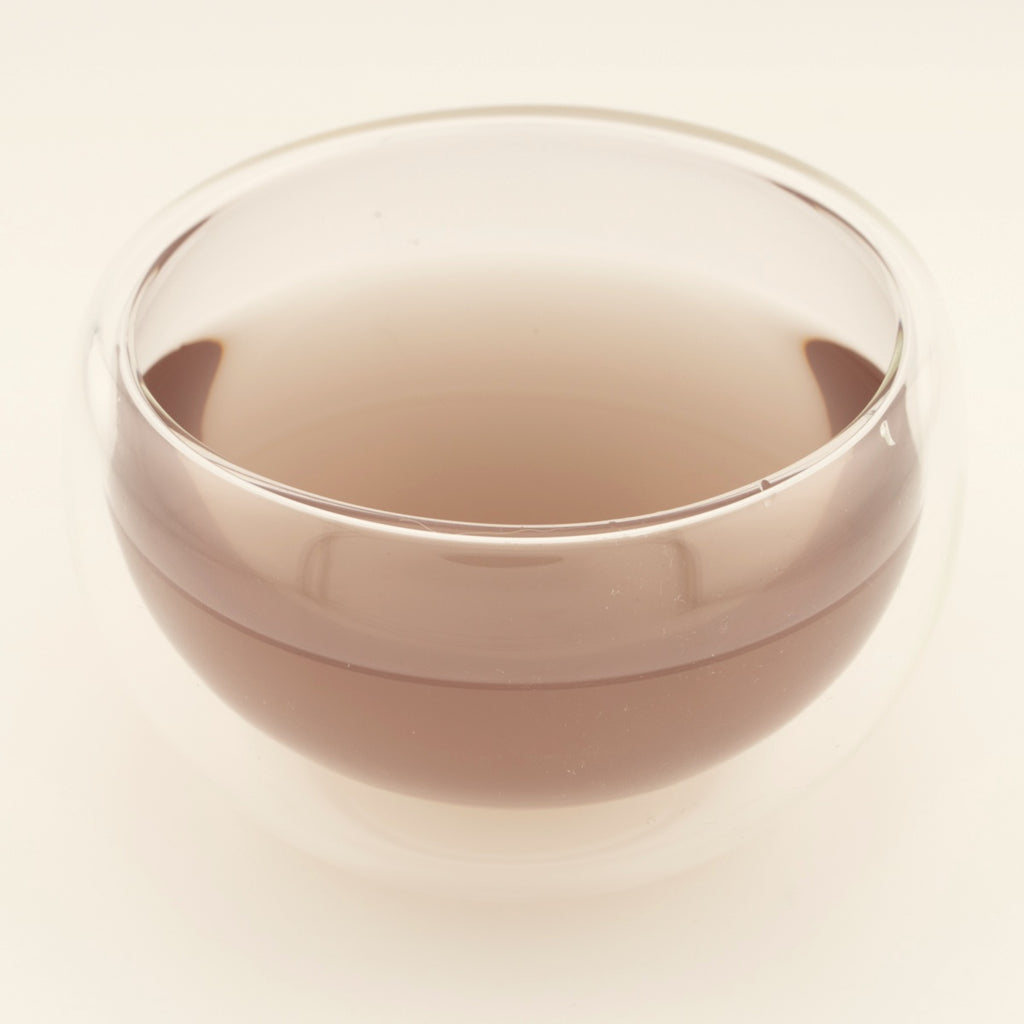 Glow Tonic, brewed, in a clear glass [glow-tonic-03-liquor]