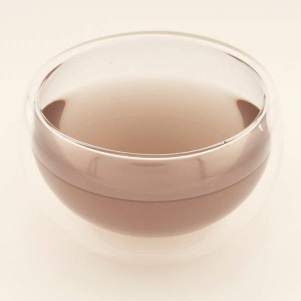 Glow Tonic, brewed, in a clear glass [glow-tonic-03-liquor]