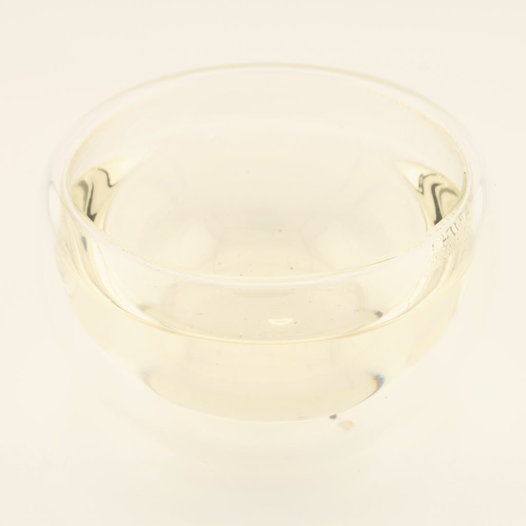 Handmade Silver Needle White Tea, brewed, in a clear glass [handmade-silver-needle-white-tea-03-liquor]