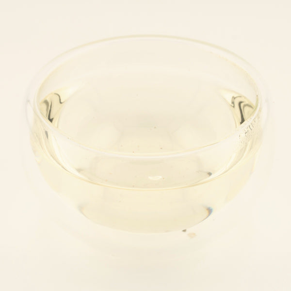 Handmade Silver Needle White Tea, brewed, in a clear glass [handmade-silver-needle-white-tea-03-liquor]