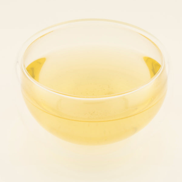 Orange Blossom Promenade Green Tea, brewed, in a clear glass [orange-blossom-promenade-03-liquor]