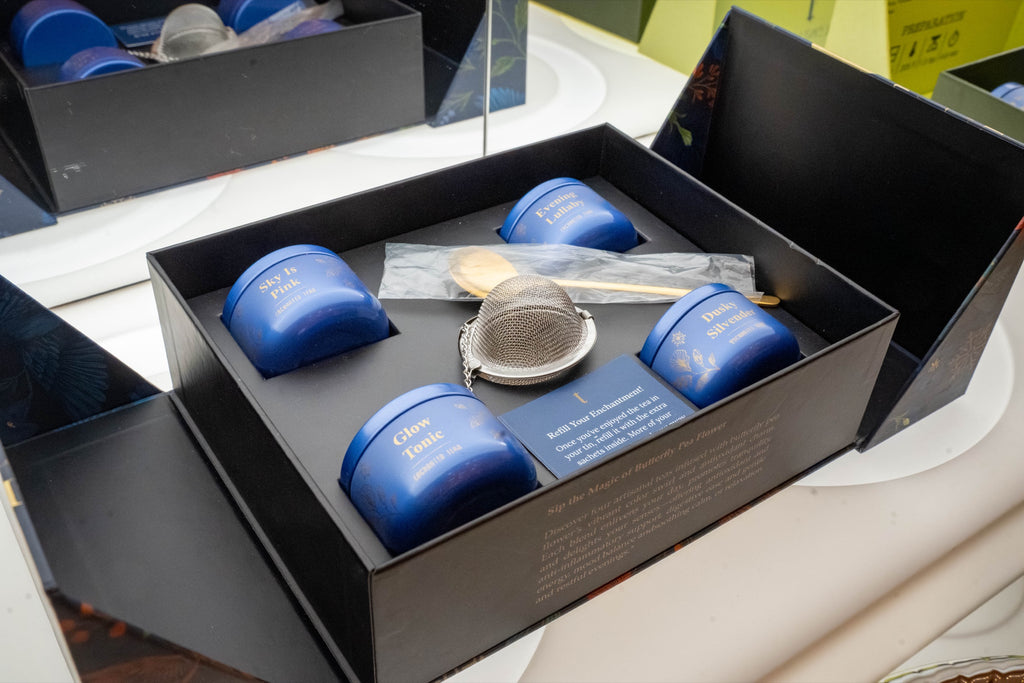 Tea Tasting Trove, the Midnight Garden box open: four tins, an infuser and a spoon [trove-03-open-midnight]