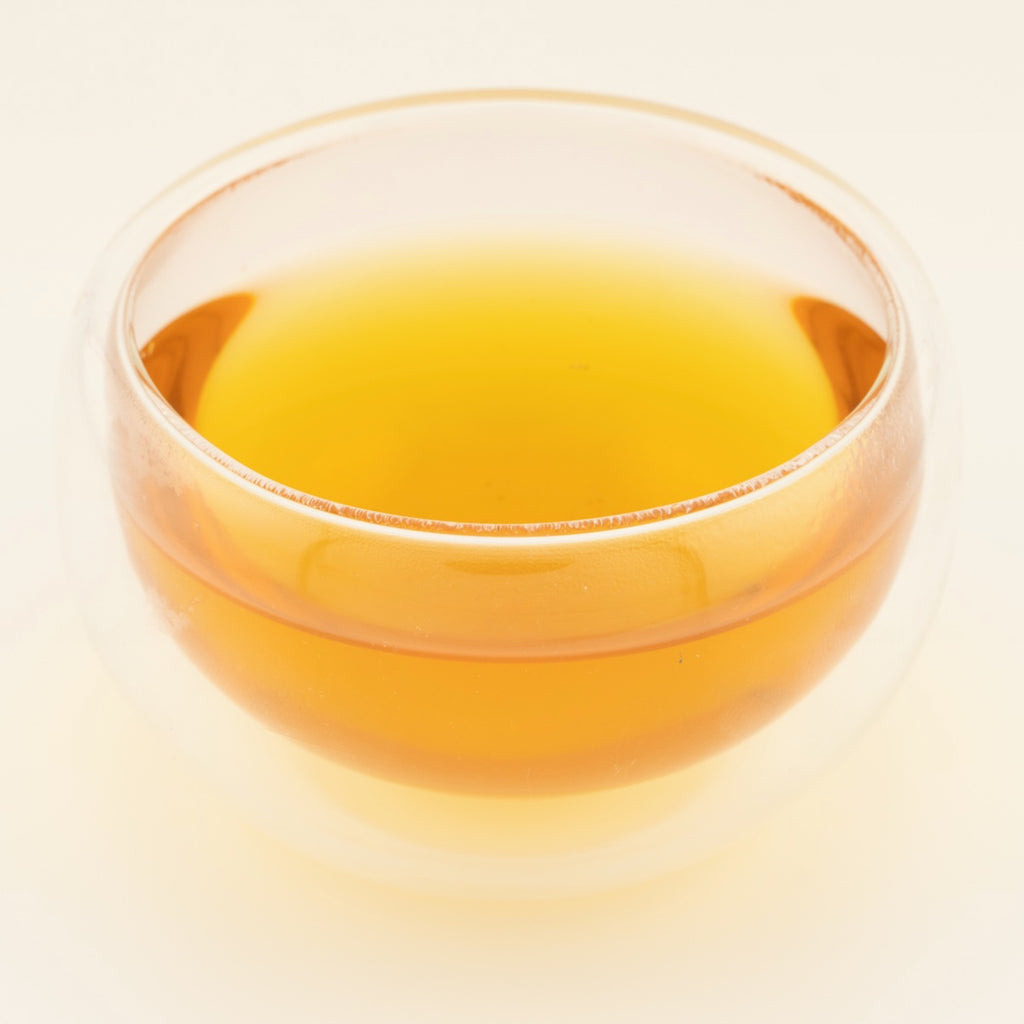 Wuyi Jin Jun Mei Black Tea, brewed, in a clear glass [wuyi-jin-jun-mei-black-tea-03-liquor]