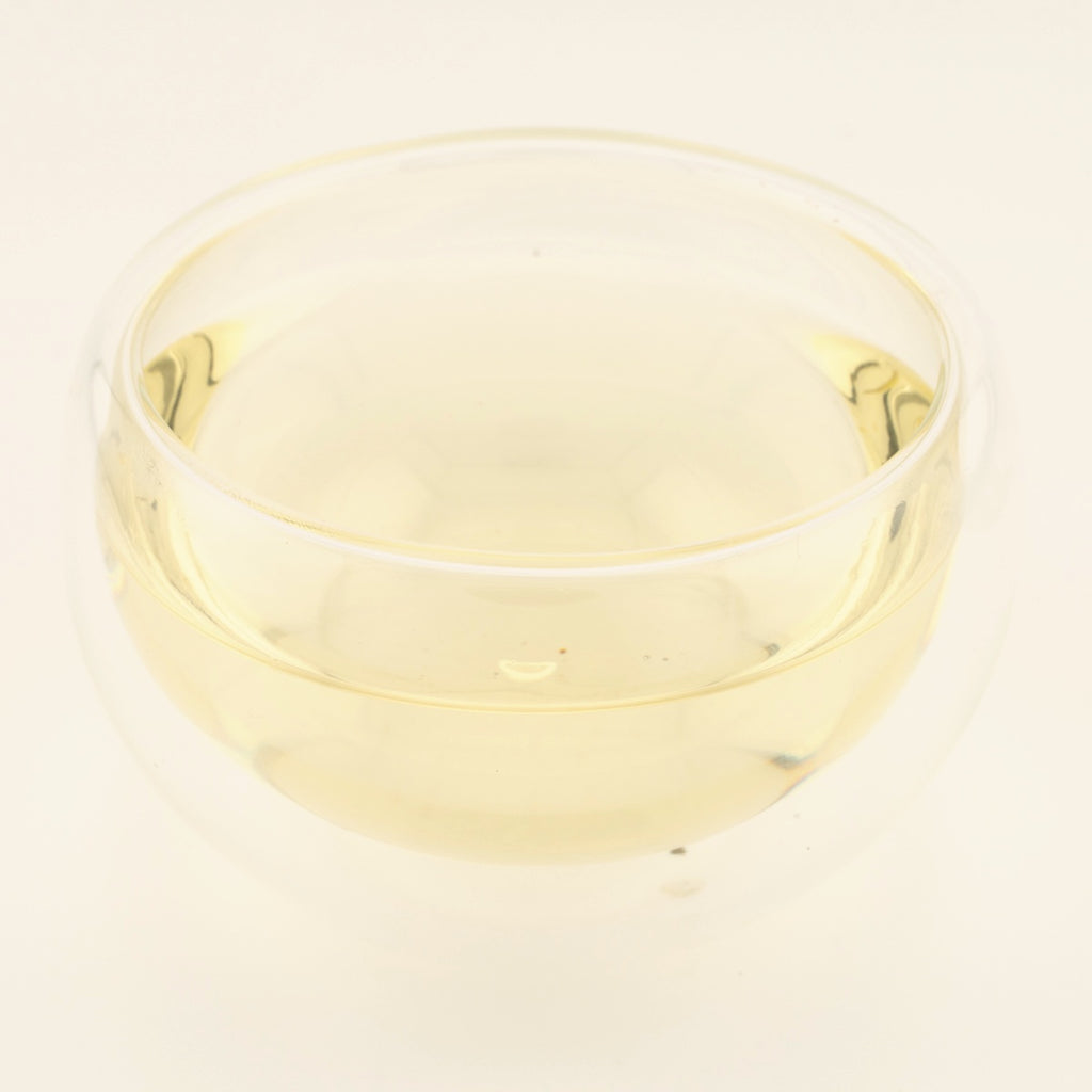 Yunnan White Bud Pu'er Tea, brewed, in a clear glass [yunnan-white-bud-puer-tea-03-liquor]